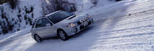 Subaru WRX clawing through the snow