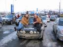 Posing on the hood at finish