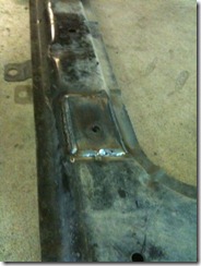 Sub frame with repair plates welded in place